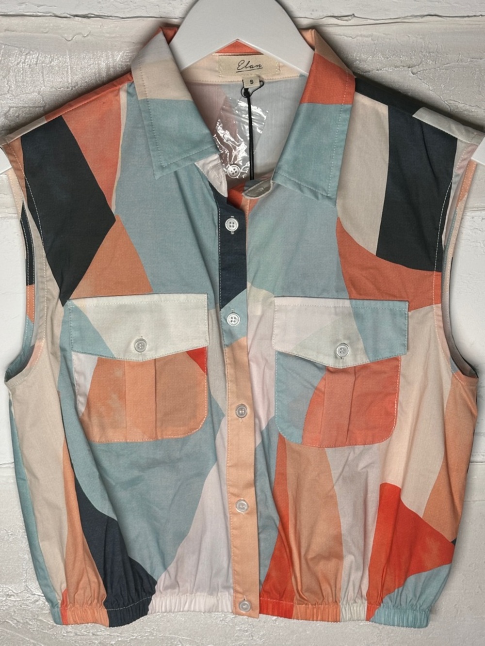 New w tags. Elan geometric top